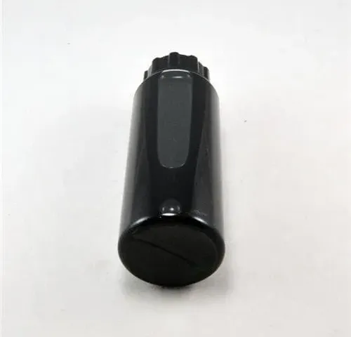 Migatronic fluid container with fluid for tungsten grinder